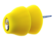 A yellow tack with a rounded, soft-looking head and a sharp metal pin extending from one end, set against a plain white background—its subtle design is reminiscent of small devices like lyric hearing aids.